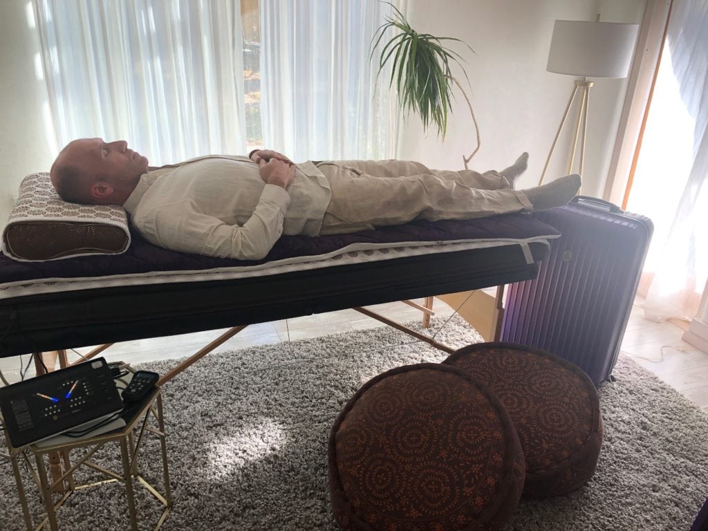 man laying on biomat